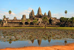 Ruins of a large structure with five large towers at the top.